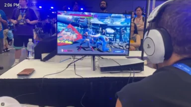 Person playing fighting game at gaming convention