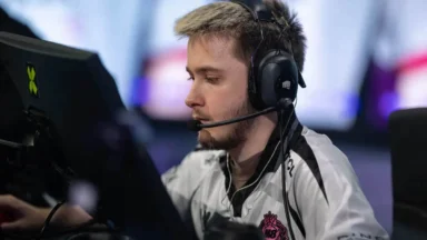 Professional esports player wearing headset at computer