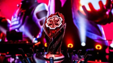 Esports championship trophy illuminated on a dramatic stage