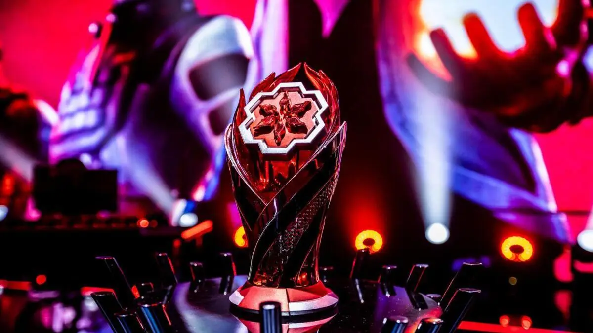 Esports championship trophy illuminated on a dramatic stage