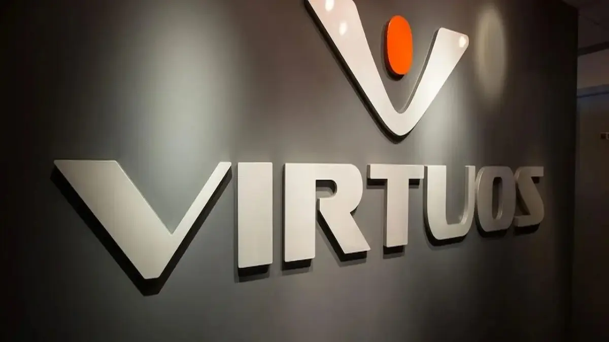 Virtuos company wall logo with orange dot.