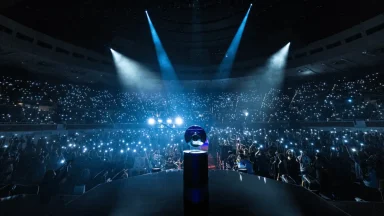 Concert crowd with lights in large arena