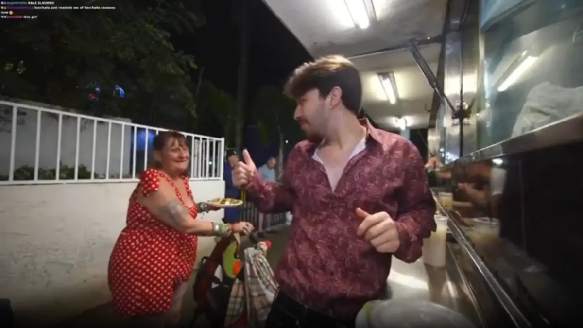 Man giving thumbs up at outdoor food stand