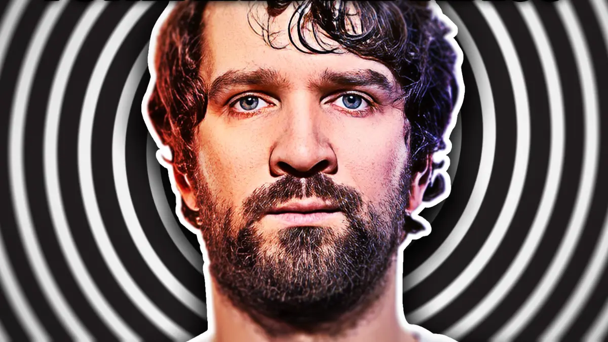 Bearded man with spiral background.