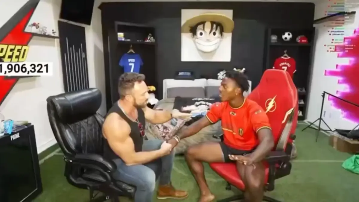 Two men talking in gaming-themed studio room