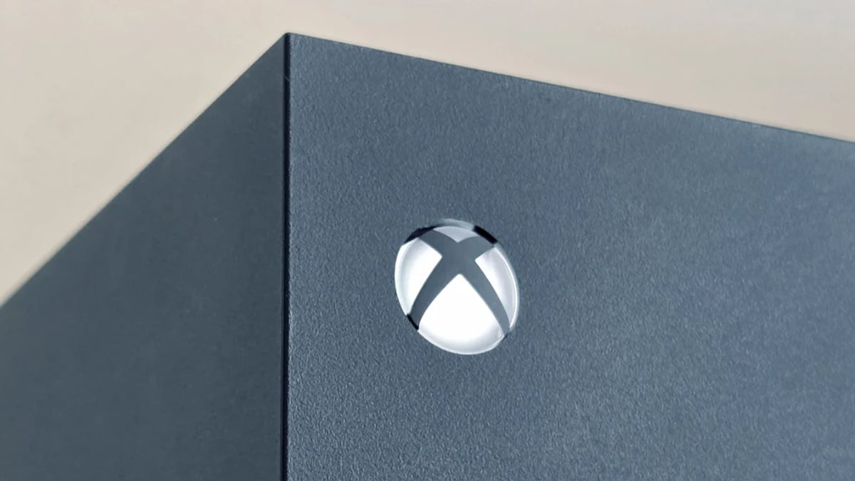 Close-up of Xbox logo on black console