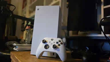 White Xbox console with wireless controller