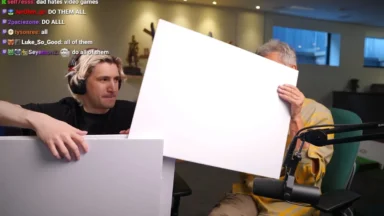 Two men hold blank boards during livestream recording
