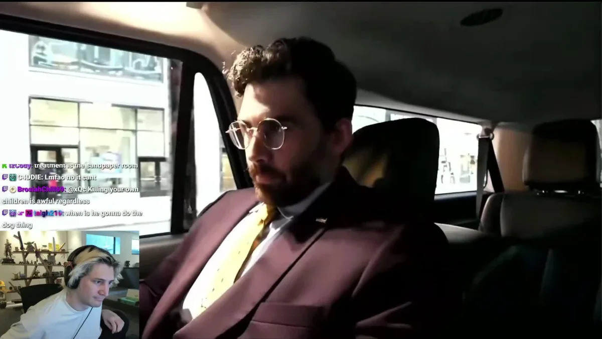 Man in suit sits in car during livestream