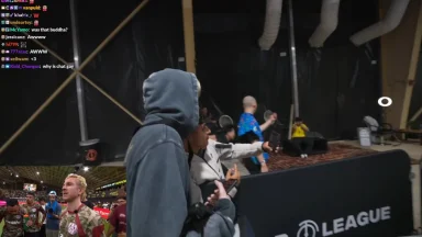 People filming near stage at esports event