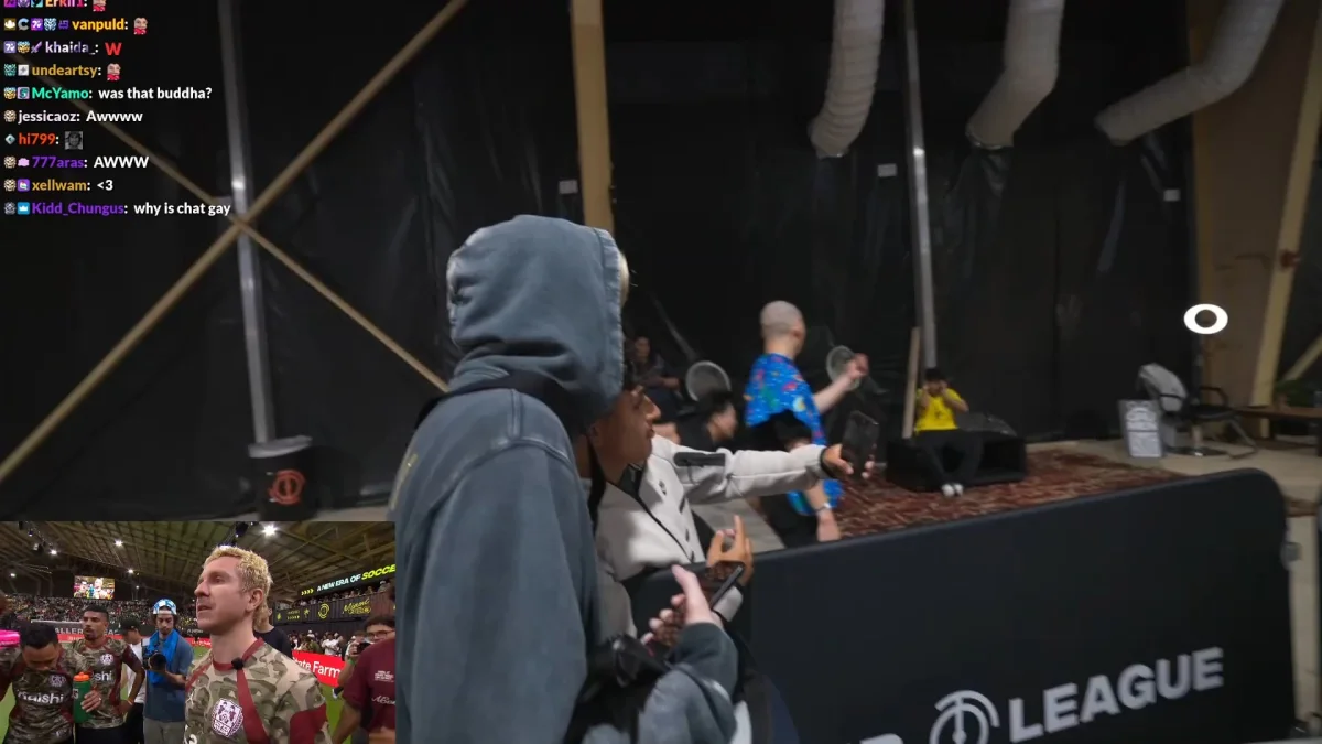 People filming near stage at esports event