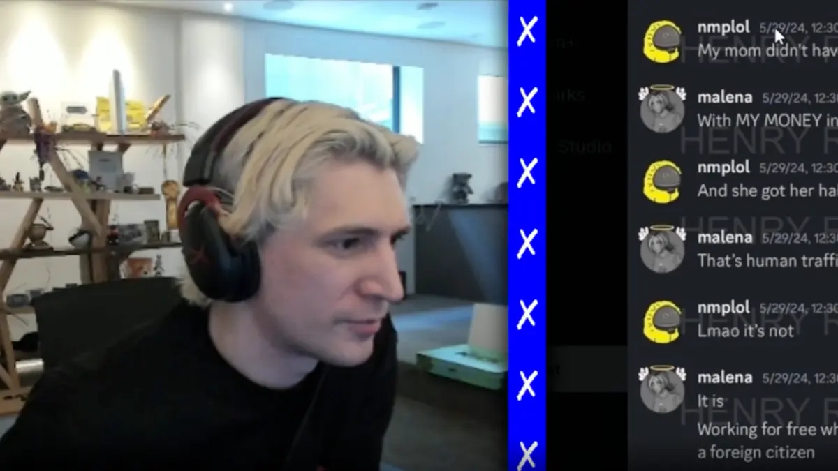 Man with headphones livestreaming at desk setup