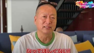 Man sitting indoors with glasses on head