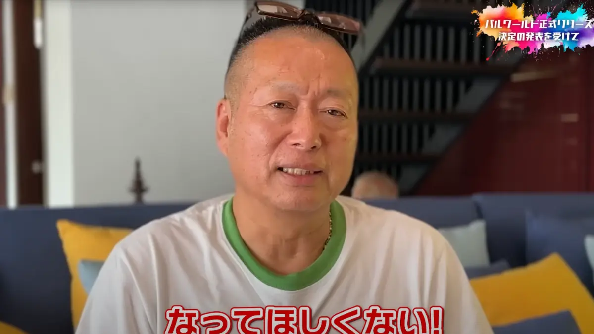 Man sitting indoors with glasses on head